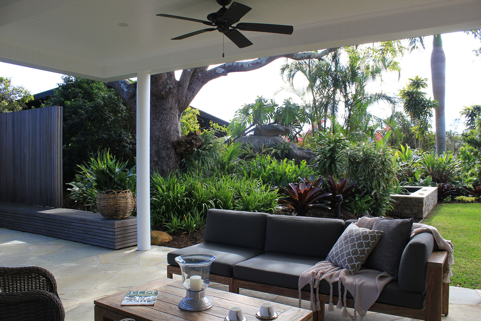 the gap outdoor entertaining area sofa bench seating and tropical garden