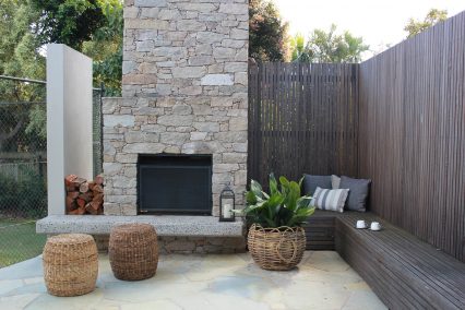 redcliffe custom made fireplace with cane basket and bench seating