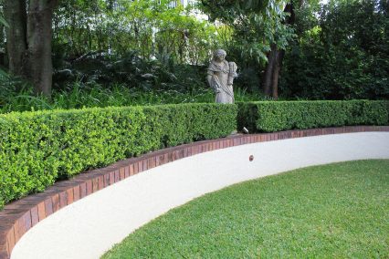 clayfield formal garden hedge with lighting