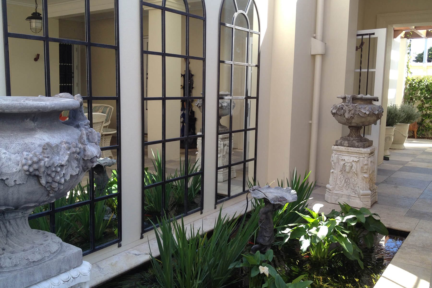 redcliffe bronze water fountain decorative urns on plinths irises and waterscaping