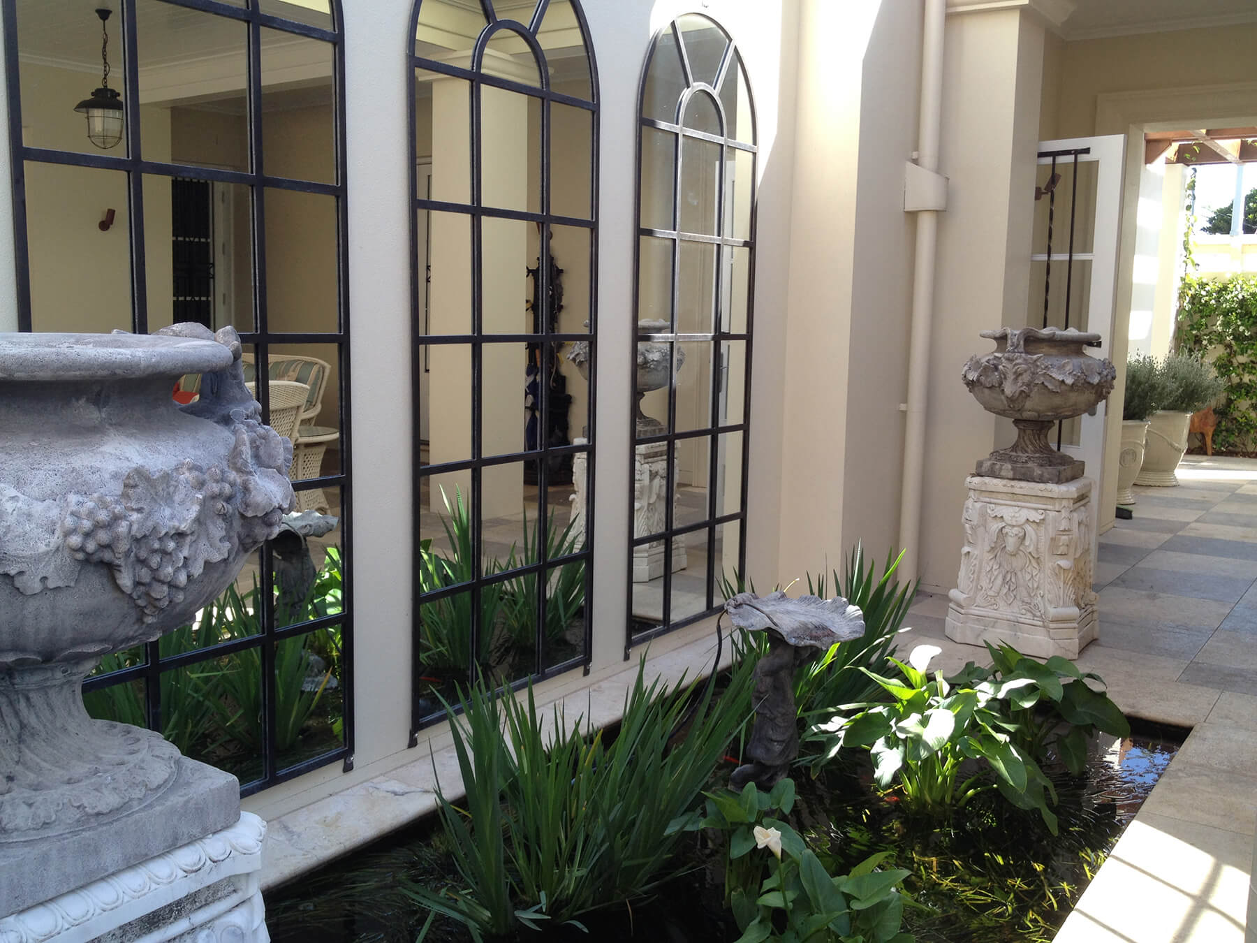 redcliffe bronze water fountain decorative urns on plinths irises and waterscaping